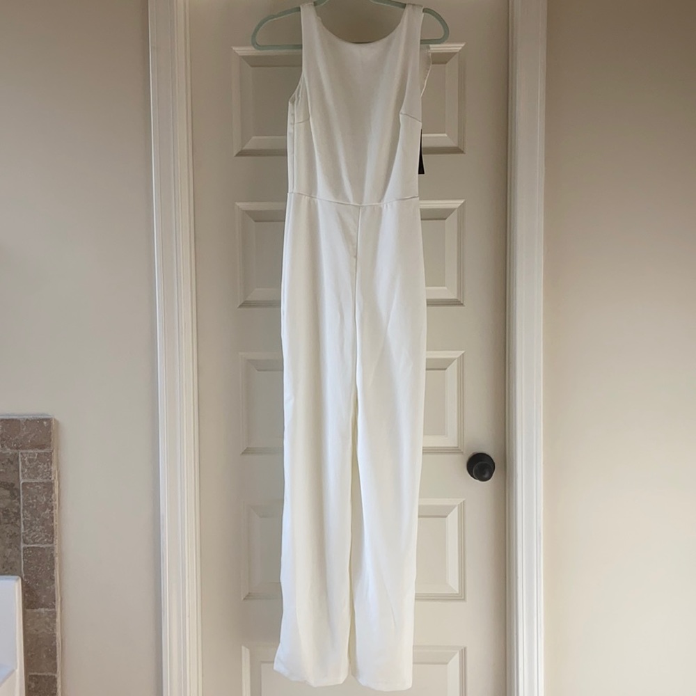 White women's jumpsuit, never worn.